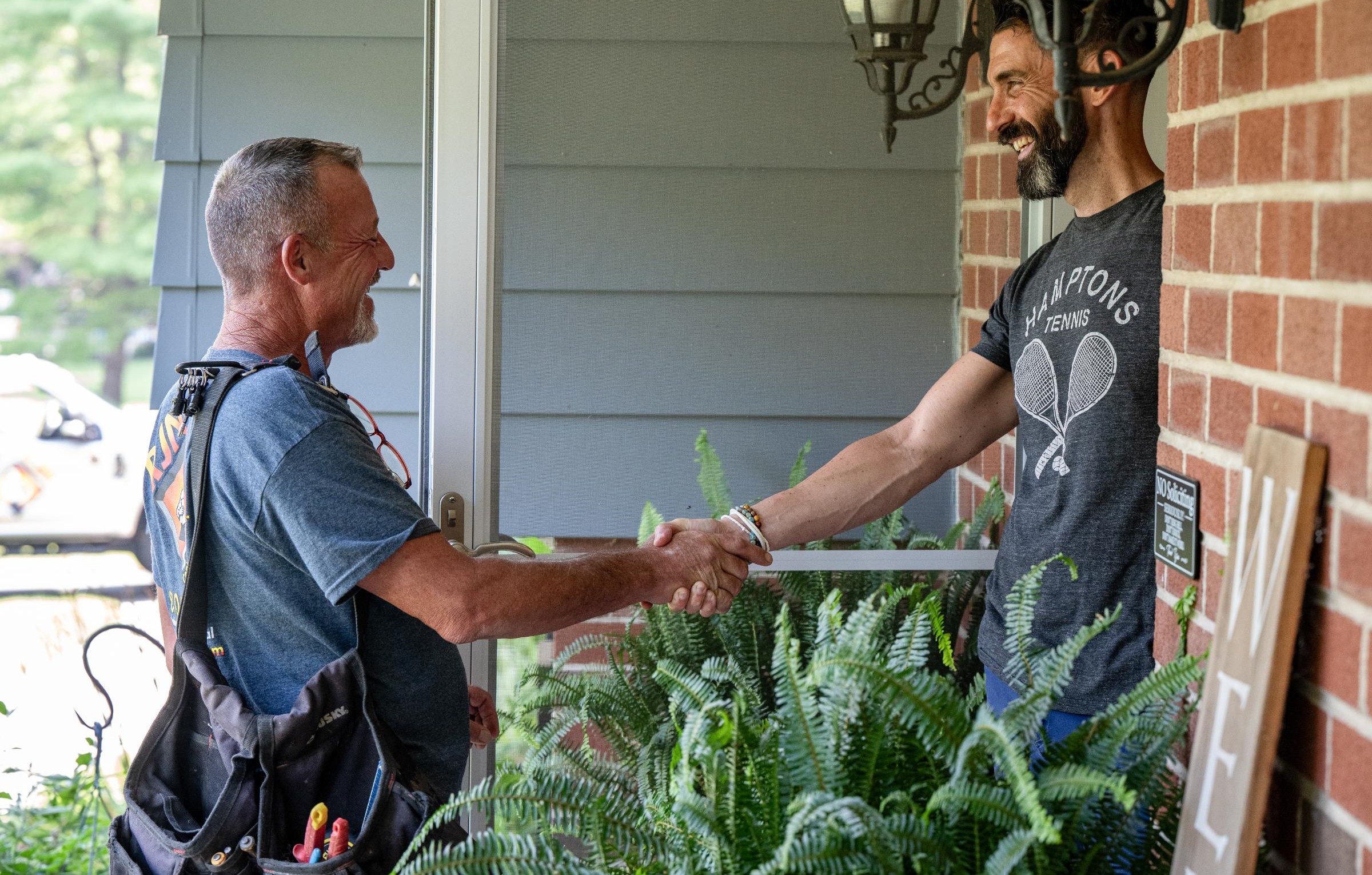 RJN employee shaking client's hand