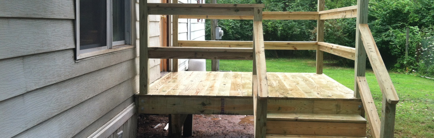 custom wood deck added onto back of house