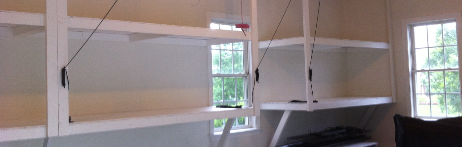 custom storage shelving units added to walls in garage